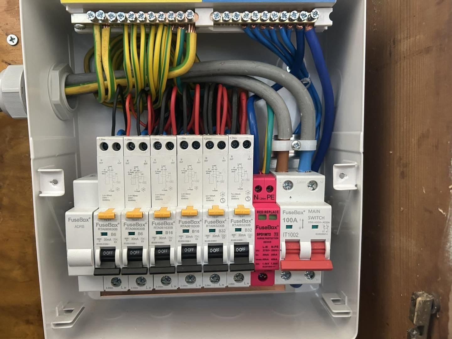 Tidy new consumer unit, neatly wired and fully labelled with surge protection