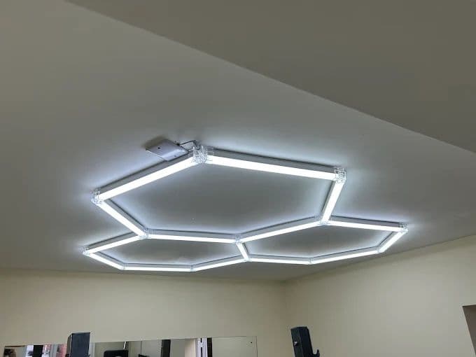 Hexagon LED ceiling light fitted in a home gym